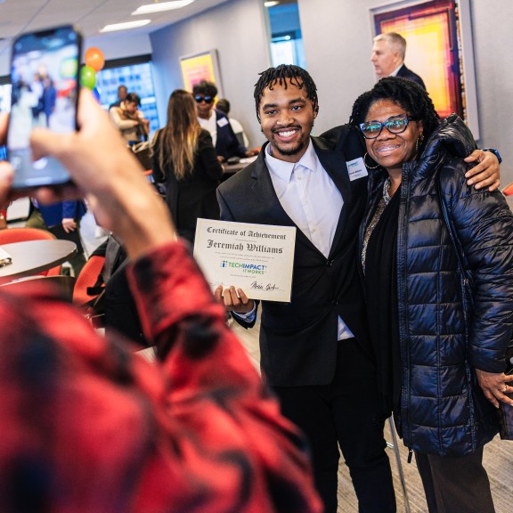 Graduate Taking Picture With Support Person