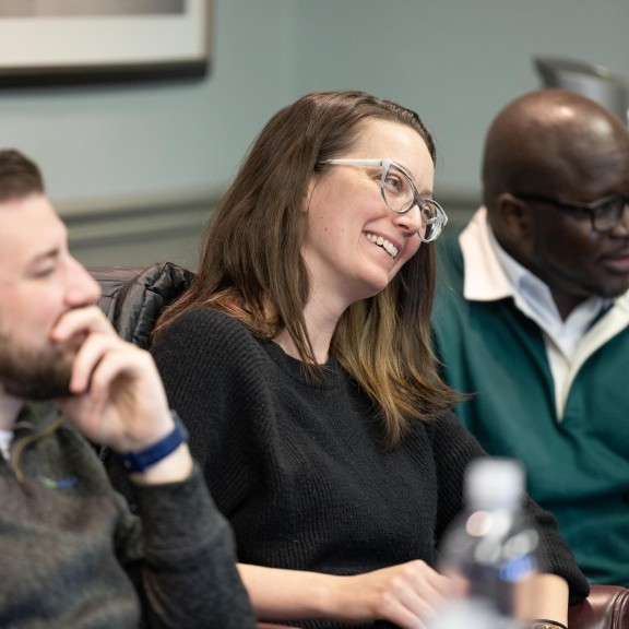 Coworkers Laughing At a Table