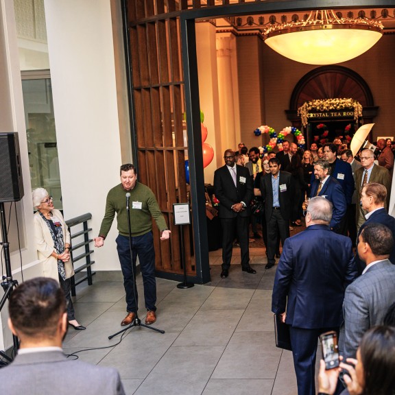 Group of event attendees listening to a speaker