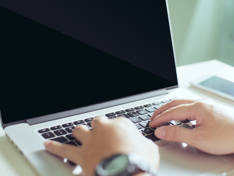 Computer Screen with hands on the keyboard