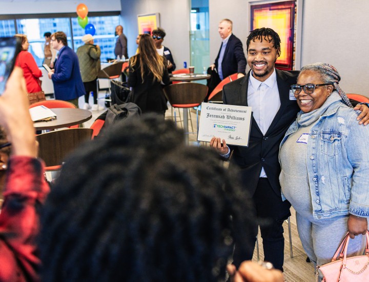 Graduate Taking Picture With Support Person